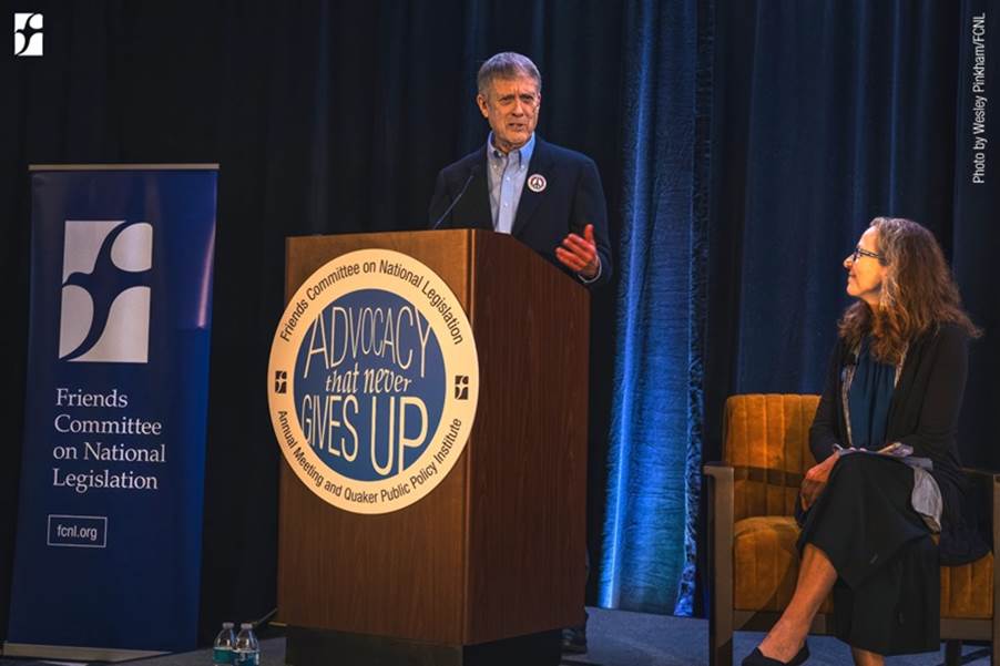 A person standing at a podium
AI-generated content may be incorrect.